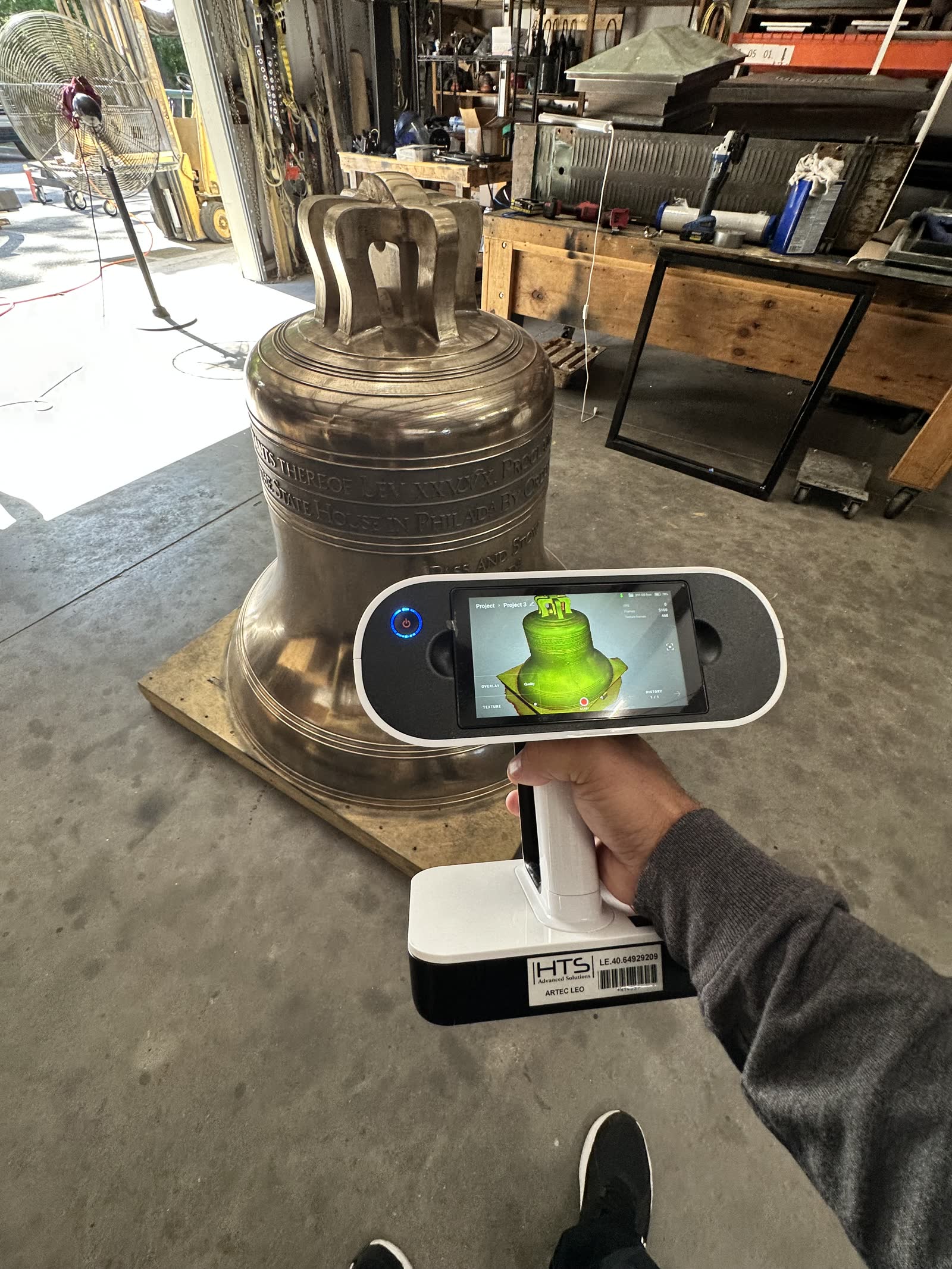 Handheld 3D scanner capturing a full size Liberty Bell casting, live scan on screen